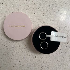 Stone and Strand 10K white gold huggie earrings.